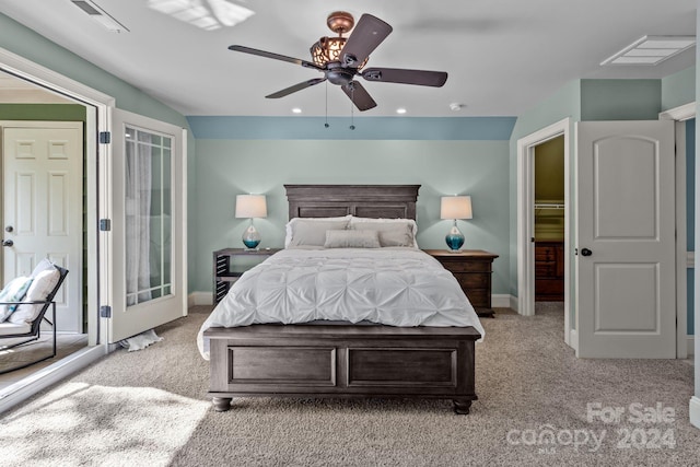 carpeted bedroom featuring access to exterior and ceiling fan