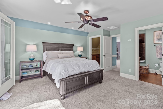 carpeted bedroom featuring connected bathroom and ceiling fan