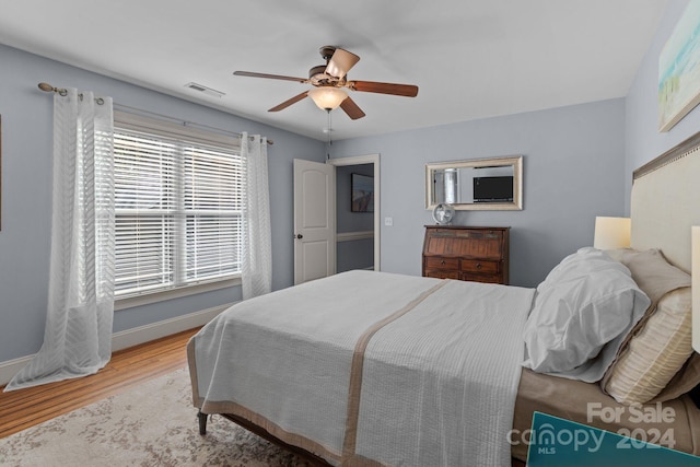 bedroom featuring hardwood / wood-style flooring and ceiling fan