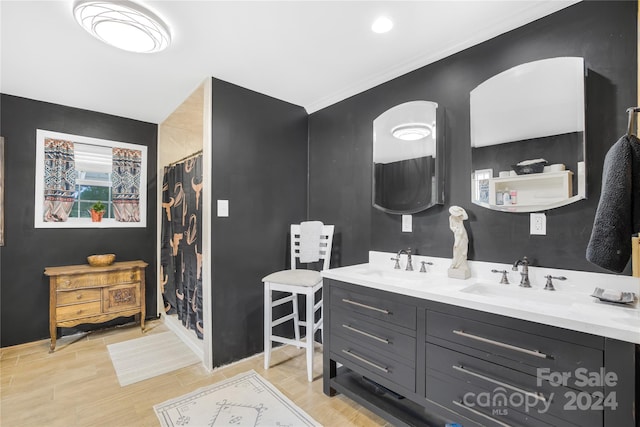 bathroom featuring vanity and curtained shower