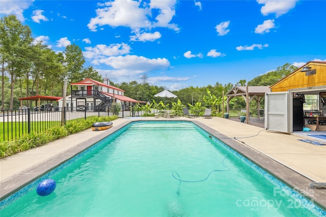 view of swimming pool featuring a patio area