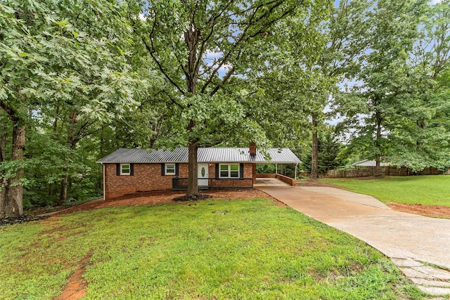 ranch-style home with a carport and a front yard