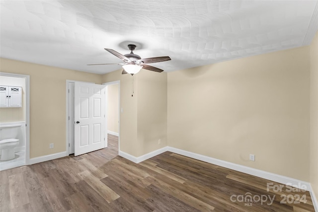 unfurnished room with ceiling fan and hardwood / wood-style floors