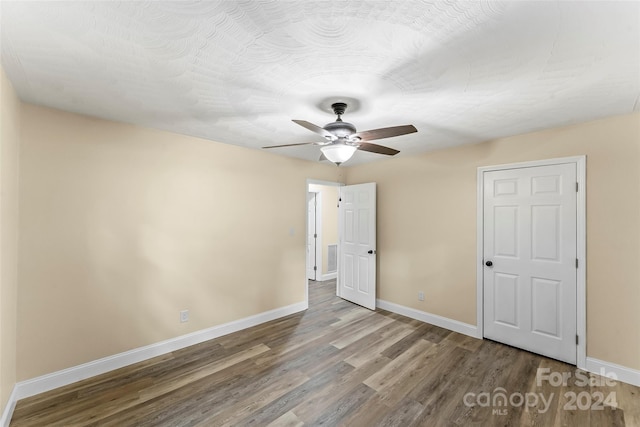 unfurnished bedroom with hardwood / wood-style flooring and ceiling fan