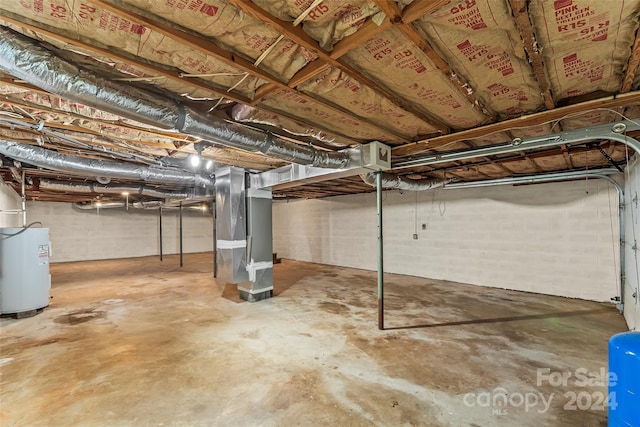 basement with heating unit and water heater