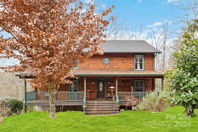 view of front of house with a porch and a front yard