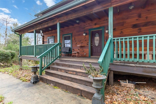 property entrance featuring a porch