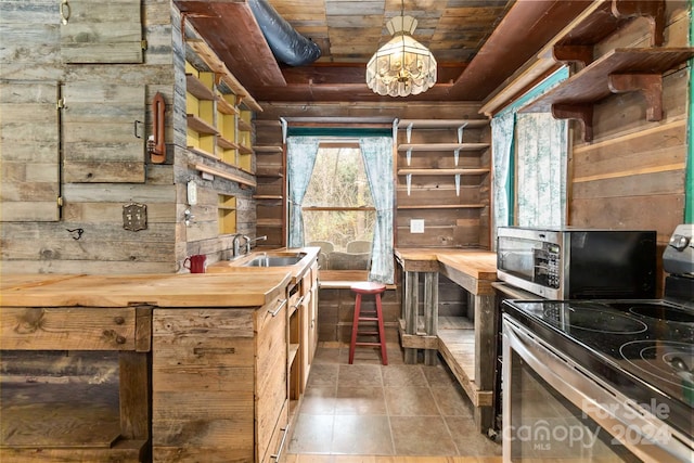902 Coldwater Ct, Concord, NC 28025 - kitchen with appliances with stainless steel finishes, wooden counters, wood ceiling, decorative light fixtures, and open shelves