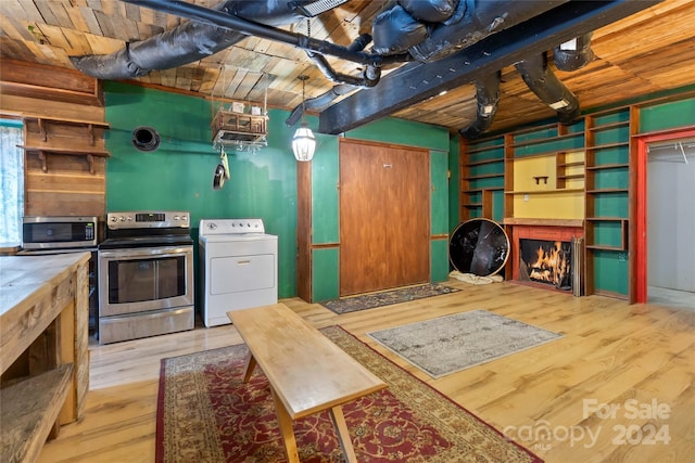 kitchen featuring appliances with stainless steel finishes, washer / dryer, light hardwood / wood-style flooring, and wooden ceiling