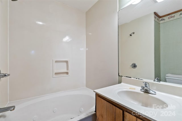 bathroom featuring vanity and toilet