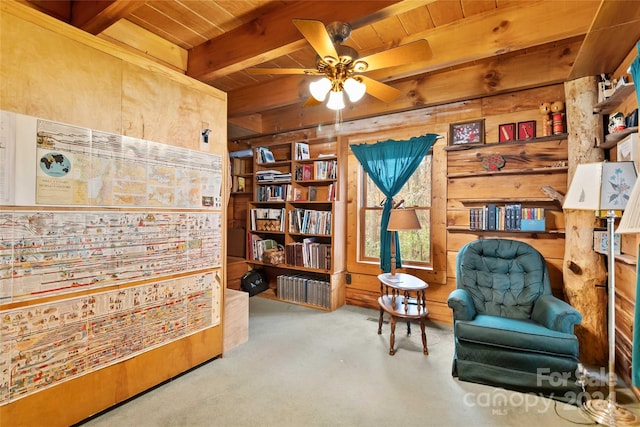 902 Coldwater Ct, Concord, NC 28025 - sitting room with a wood ceiling with exposed beams, wood walls, carpet, and ceiling fan