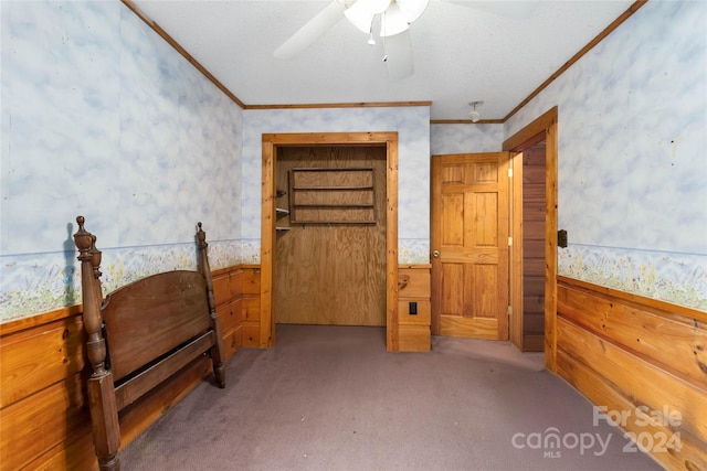 bedroom with ornamental molding, light colored carpet, and ceiling fan