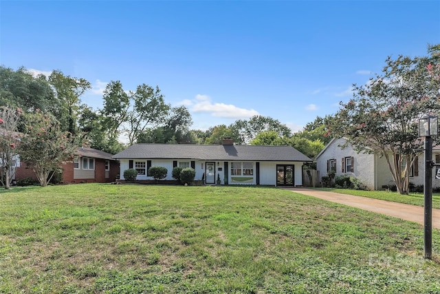 ranch-style house featuring a front lawn