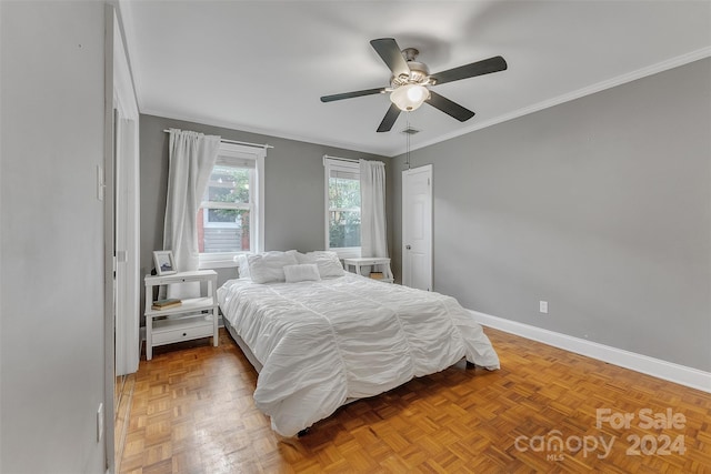 bedroom featuring crown molding, parquet floors, and ceiling fan