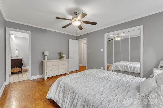 bedroom featuring light parquet floors, crown molding, ceiling fan, and a closet