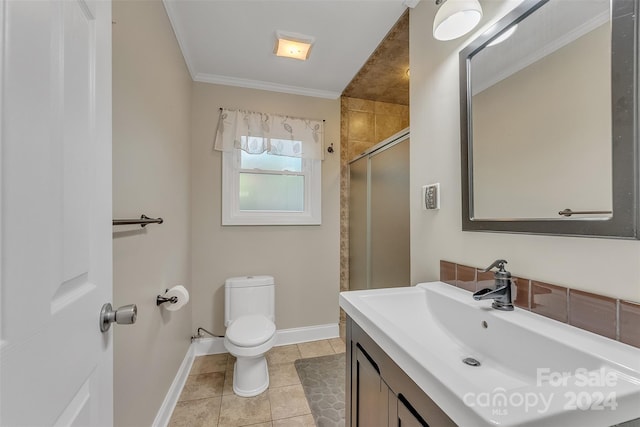 bathroom featuring ornamental molding, vanity, walk in shower, toilet, and tile patterned floors