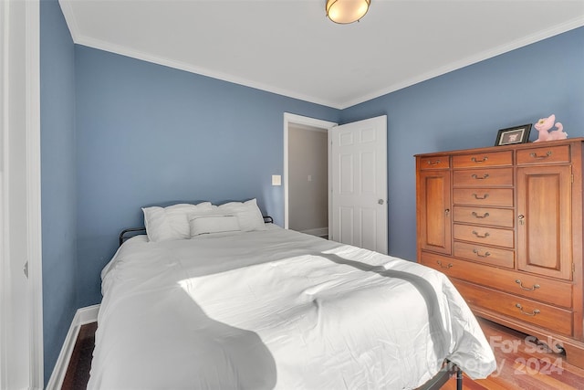 bedroom featuring crown molding