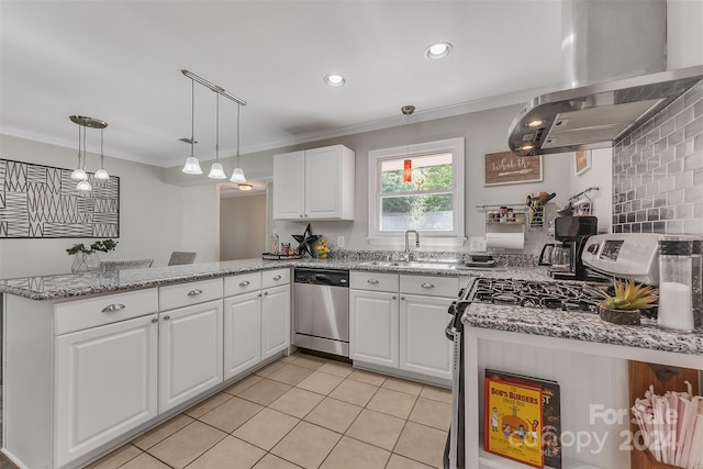 kitchen with appliances with stainless steel finishes, pendant lighting, island range hood, white cabinets, and kitchen peninsula