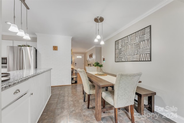 dining space with crown molding