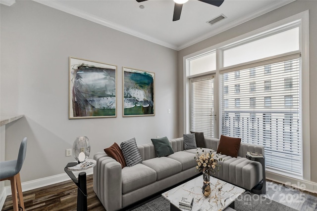 living room featuring crown molding, ceiling fan, and dark wood-type flooring