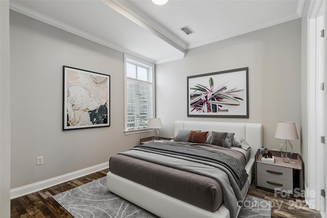 bedroom with dark hardwood / wood-style flooring and ornamental molding