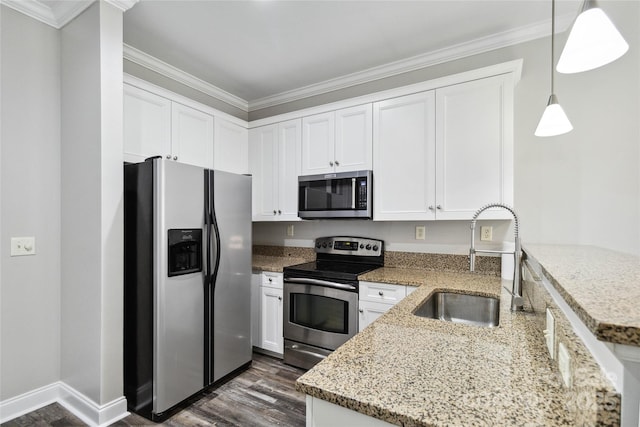 kitchen with white cabinets, decorative light fixtures, sink, and stainless steel appliances