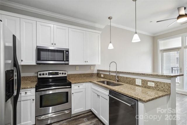 kitchen with white cabinetry, sink, kitchen peninsula, pendant lighting, and appliances with stainless steel finishes