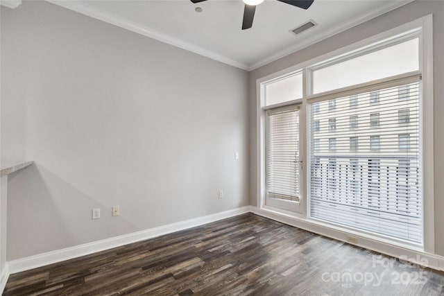 empty room with dark wood-type flooring, ceiling fan, and crown molding