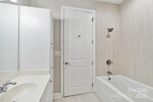 bathroom featuring vanity and shower / bathtub combination