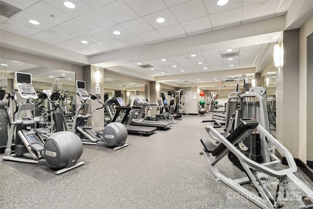 gym featuring a drop ceiling