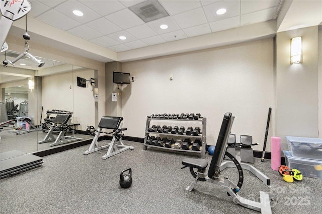 gym featuring a paneled ceiling