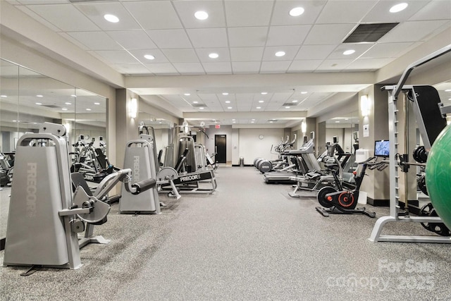 workout area with a paneled ceiling