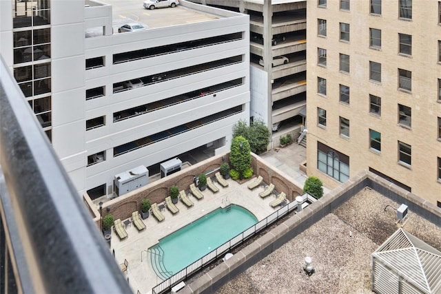 view of building exterior featuring a community pool