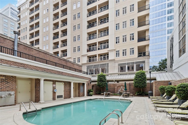 view of swimming pool with a patio area