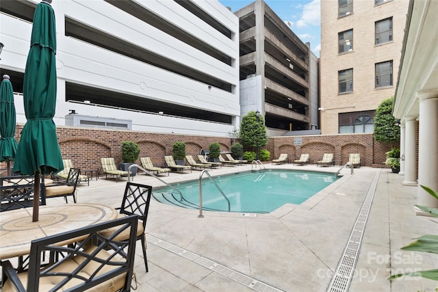 view of pool featuring a patio area