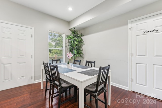 dining room with dark wood-type flooring