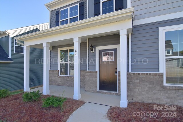 entrance to property with covered porch