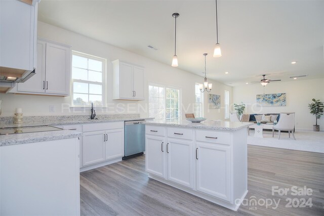 kitchen with white cabinets, dishwasher, light hardwood / wood-style flooring, and a wealth of natural light