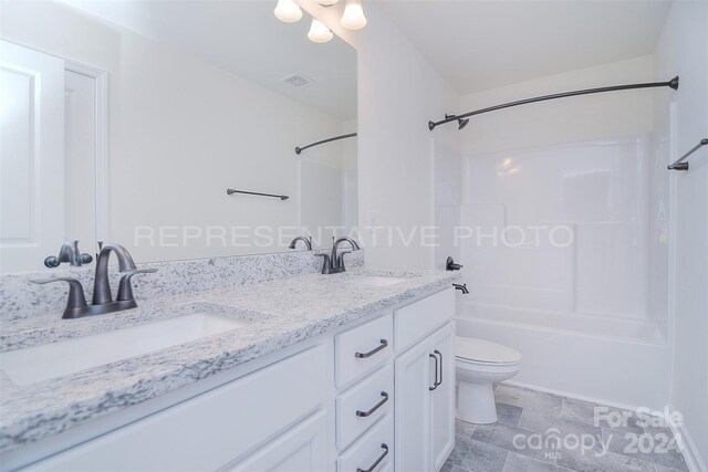 full bathroom featuring double vanity, shower / bathing tub combination, tile patterned floors, and toilet