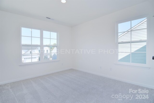 empty room featuring carpet flooring