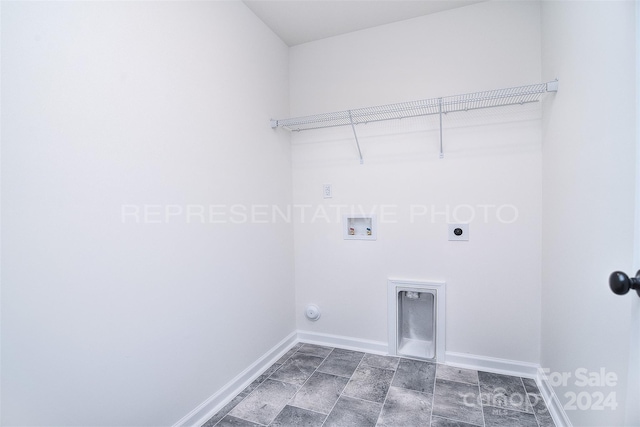 laundry room with washer hookup, hookup for an electric dryer, dark tile patterned flooring, and hookup for a gas dryer