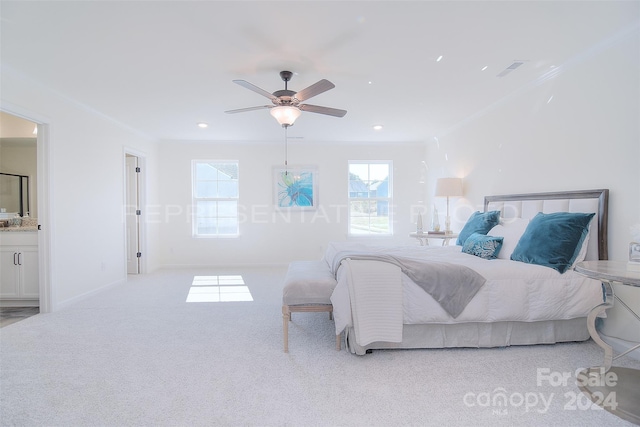 carpeted bedroom featuring ensuite bathroom and ceiling fan