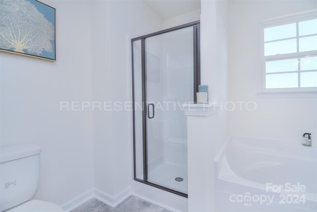 bathroom featuring tile patterned floors, independent shower and bath, and toilet