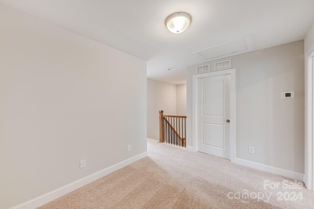 empty room featuring carpet floors