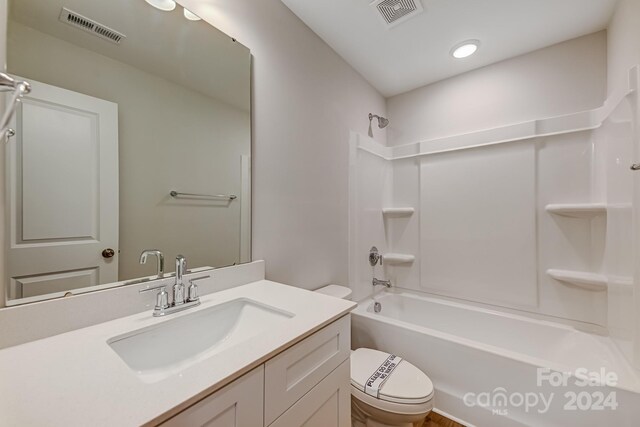 full bathroom with shower / bathtub combination, toilet, and vanity