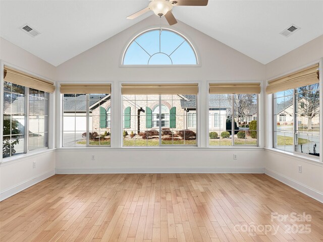 unfurnished sunroom featuring ceiling fan and vaulted ceiling