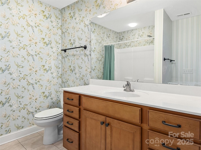 bathroom with tile patterned flooring, a shower with curtain, toilet, and vanity