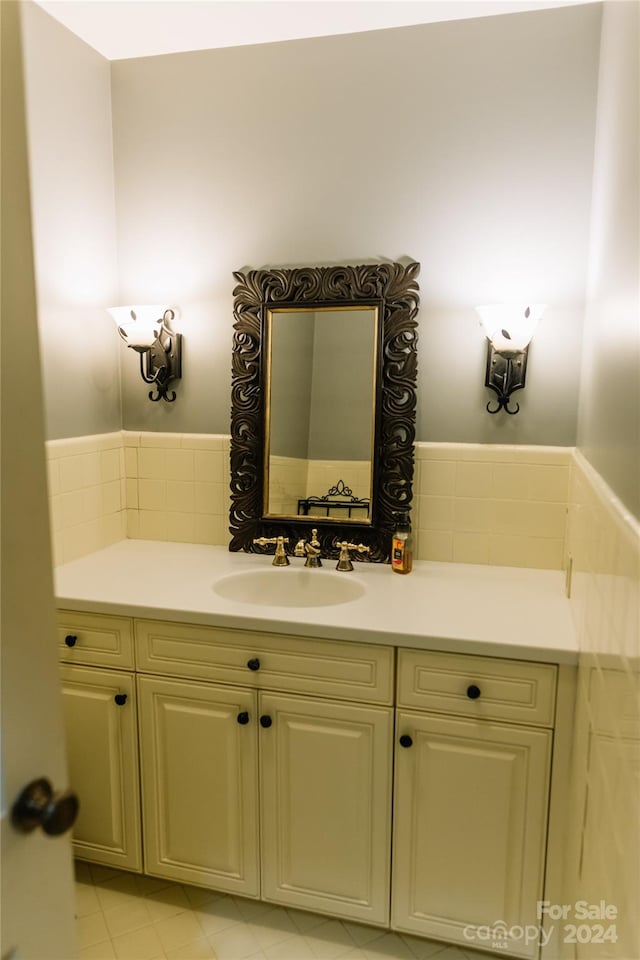 bathroom with tile patterned flooring and vanity