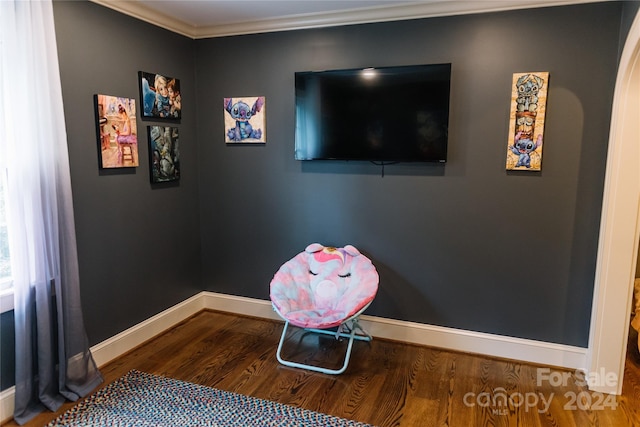 interior space with crown molding and hardwood / wood-style floors