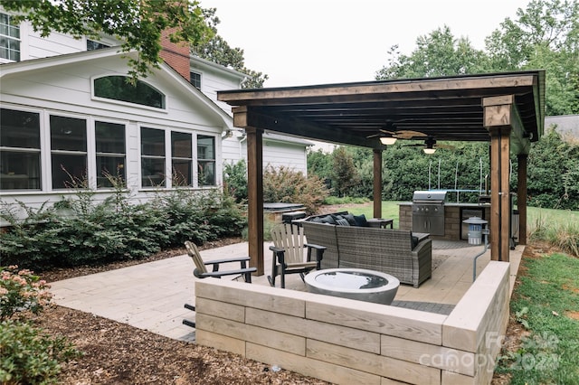 view of patio featuring an outdoor living space with a fire pit, ceiling fan, and a grill